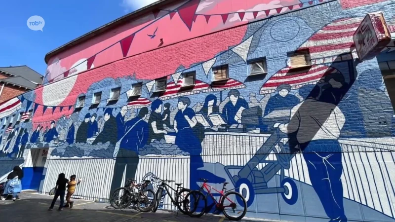 Muurschildering "versmarkt" van kunstenaarscollectief Treepack siert gevel van Delhaize Denon in Leuven